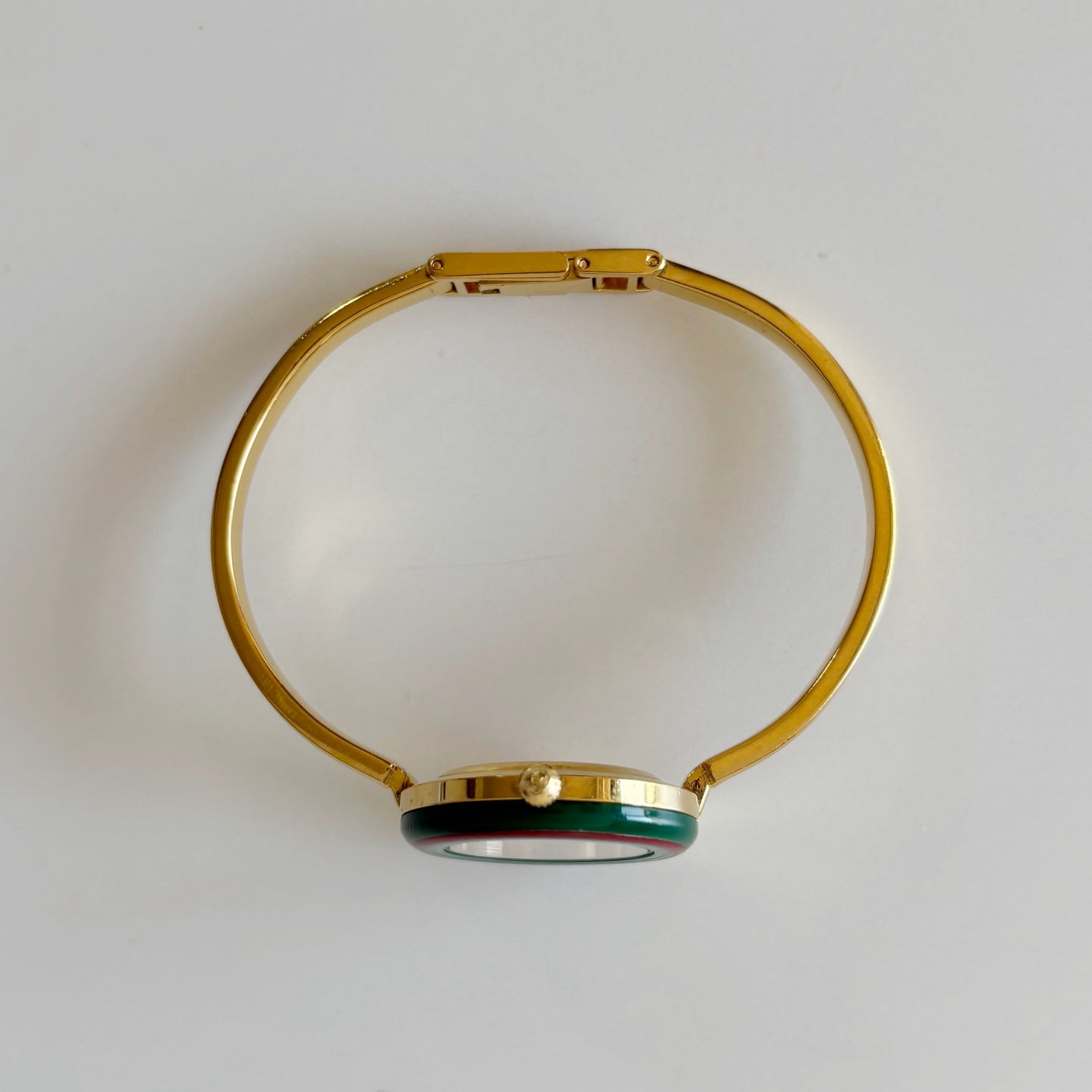 Gucci 1990s Interchangeable Bezel Gold Plated Bangle Watch with 12 bezels, case