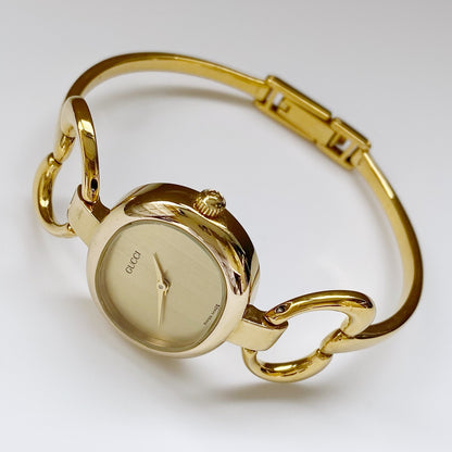 Gucci 1990s Oval Gold Plated Bangle Watch