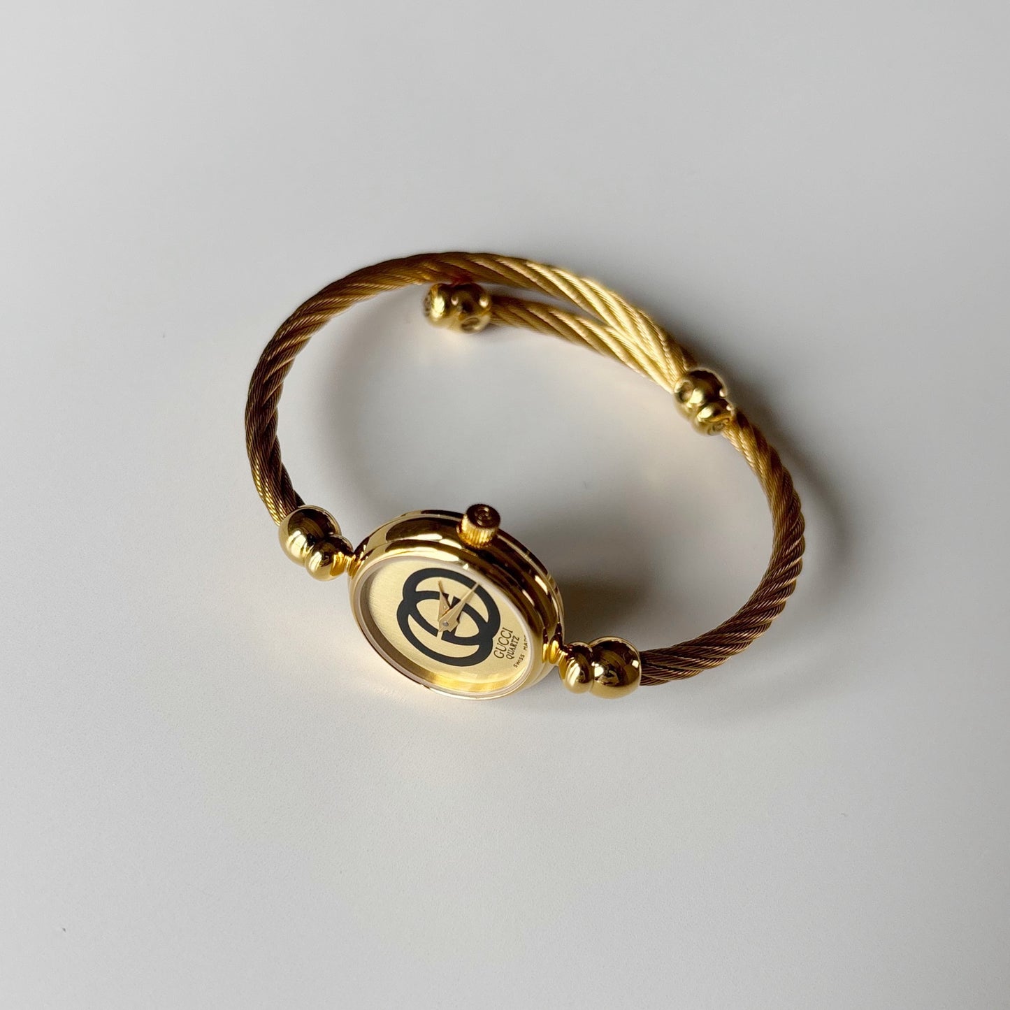 Gucci 1980s Round Dial Cable Band Bangle Watch