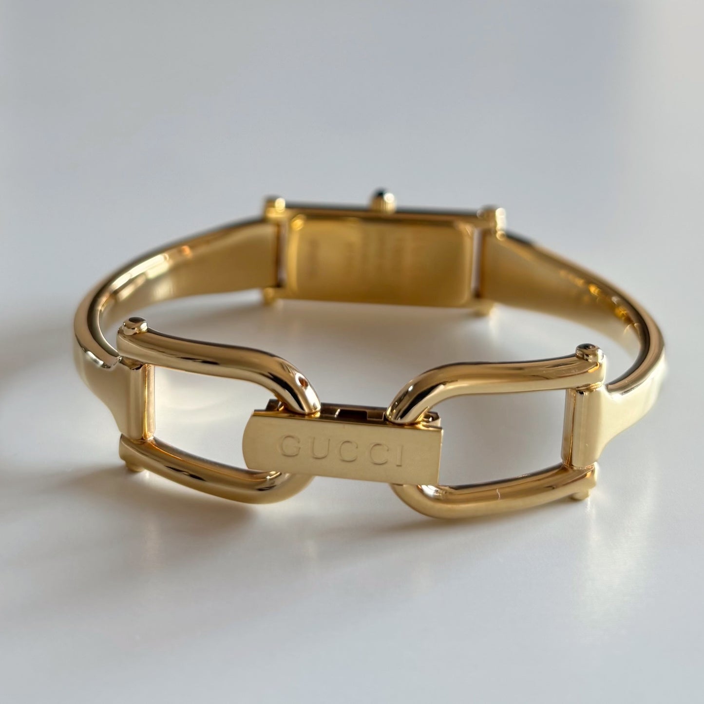 Gucci 1990s Rectangular Gold Dial Gold Plated Bangle Watch