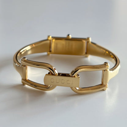 Gucci 1990s Rectangular Gold Dial Gold Plated Bangle Watch