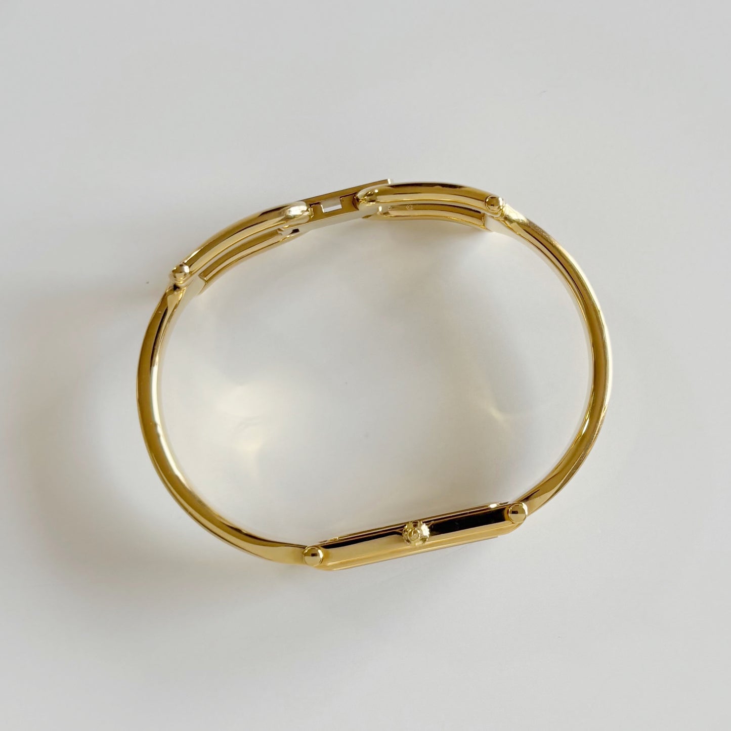 Gucci 1980s Rectangular Gold Dial Gold Plated Bangle Watch