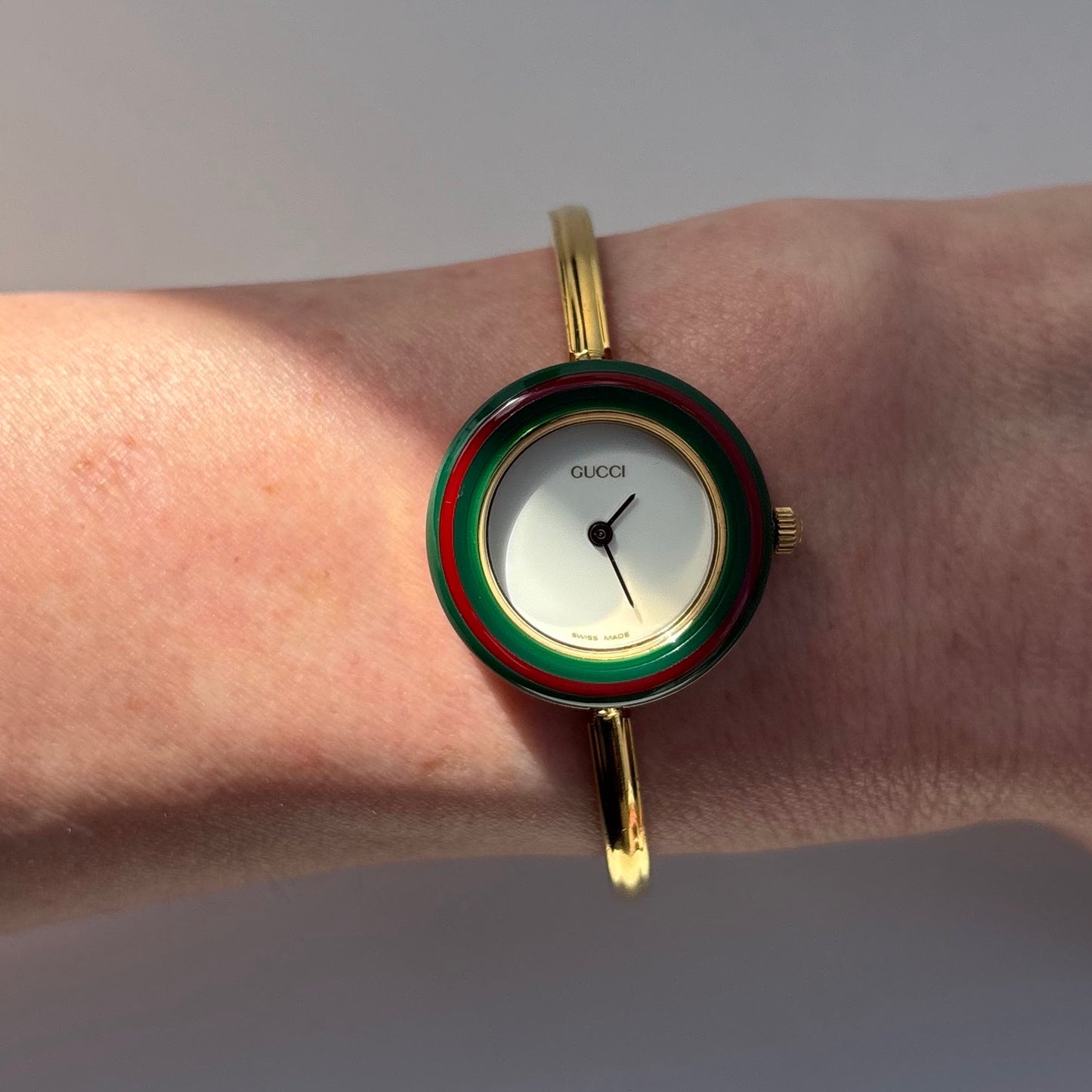 Gucci 1990s Interchangeable Bezel Gold Plated Bangle Watch with 12 bezels, case