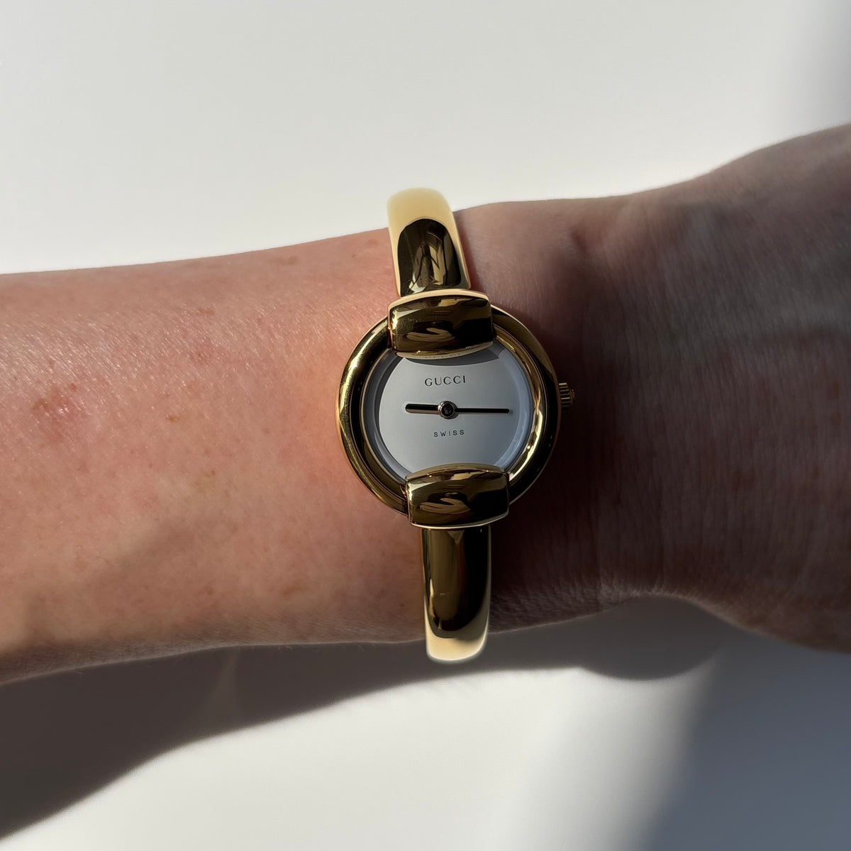 Gucci Round Dial Gold-Plated Bangle Watch
