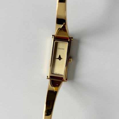 Gucci 1990s Gold Rectangular Dial Gold Plated Bangle Watch