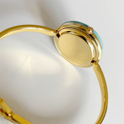 Gucci 1990s Interchangeable Bezel Gold Plated Bangle Watch with 12 bezels, case