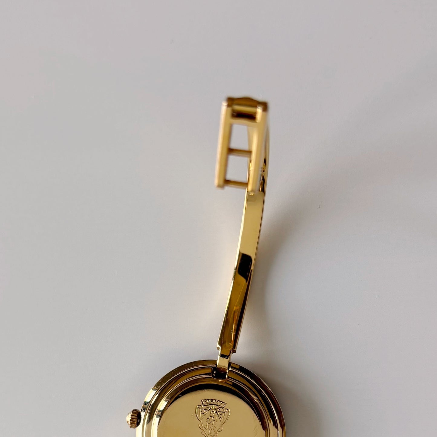 Gucci 1990s Interchangeable Bezel Gold Plated Bangle Watch with 12 bezels, case