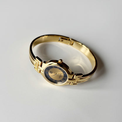 Givenchy 1990s Round Dial Gold Plated Bangle Watch