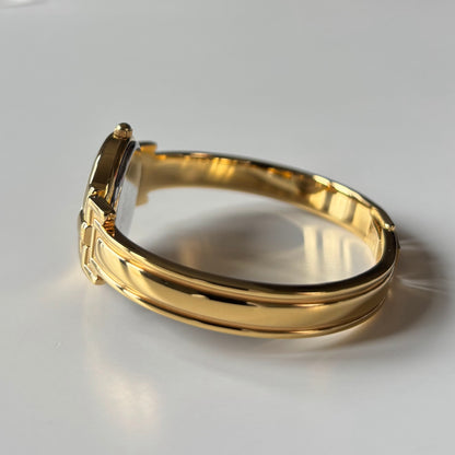 Givenchy 1990s Round Dial Gold Plated Bangle Watch