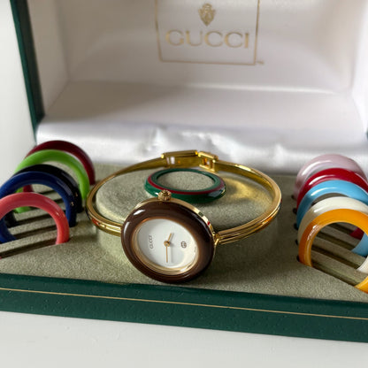Gucci 1990s Interchangeable Bezel Gold Plated Bangle Watch with 12 bezels, case
