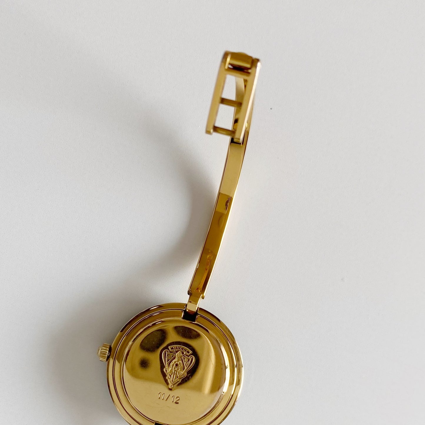 Gucci 1990s Interchangeable Bezel Gold Plated Bangle Watch with 12 bezels, case