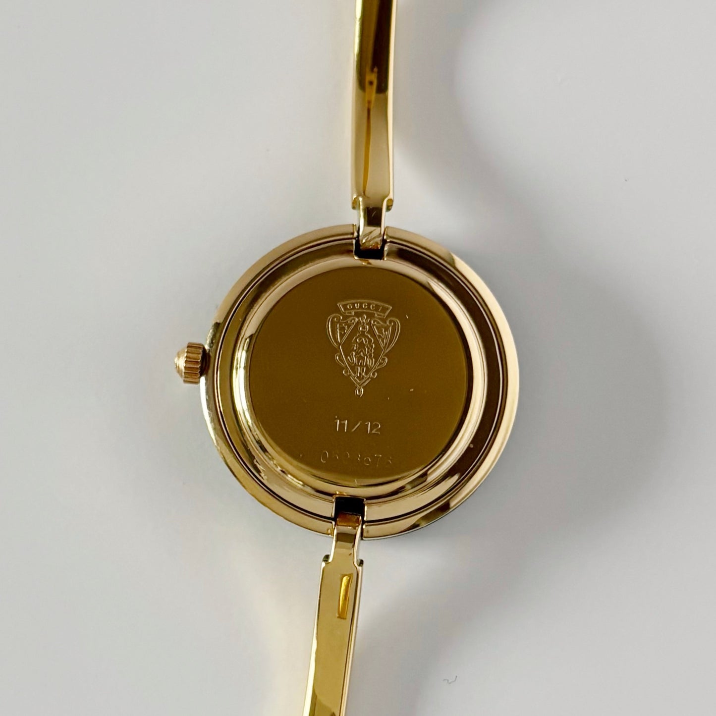 Gucci 1990s Interchangeable Bezel Gold Plated Bangle Watch with 12 bezels, case
