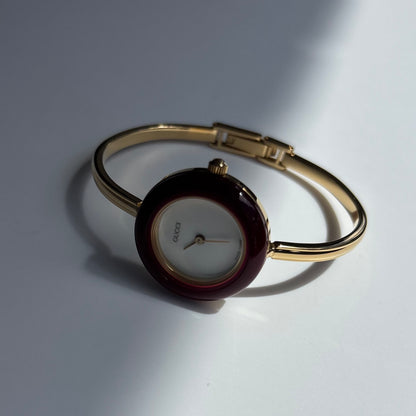 Gucci 1990s Interchangeable Bezel Gold Plated Bangle Watch with 12 bezels, case