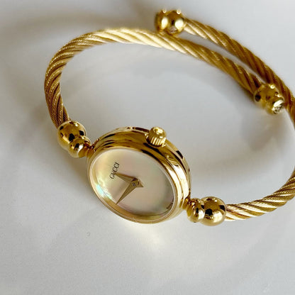 Gucci 1990s Seashell Dial Gold Plated Cable Bangle Watch