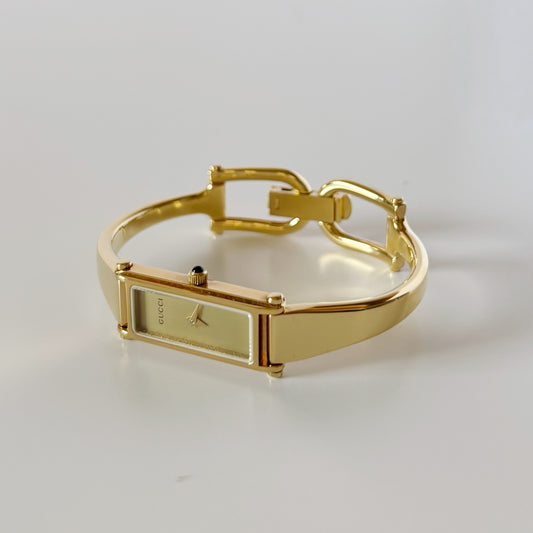Gucci 1990s Gold Rectangular Dial Gold Plated Bangle Watch