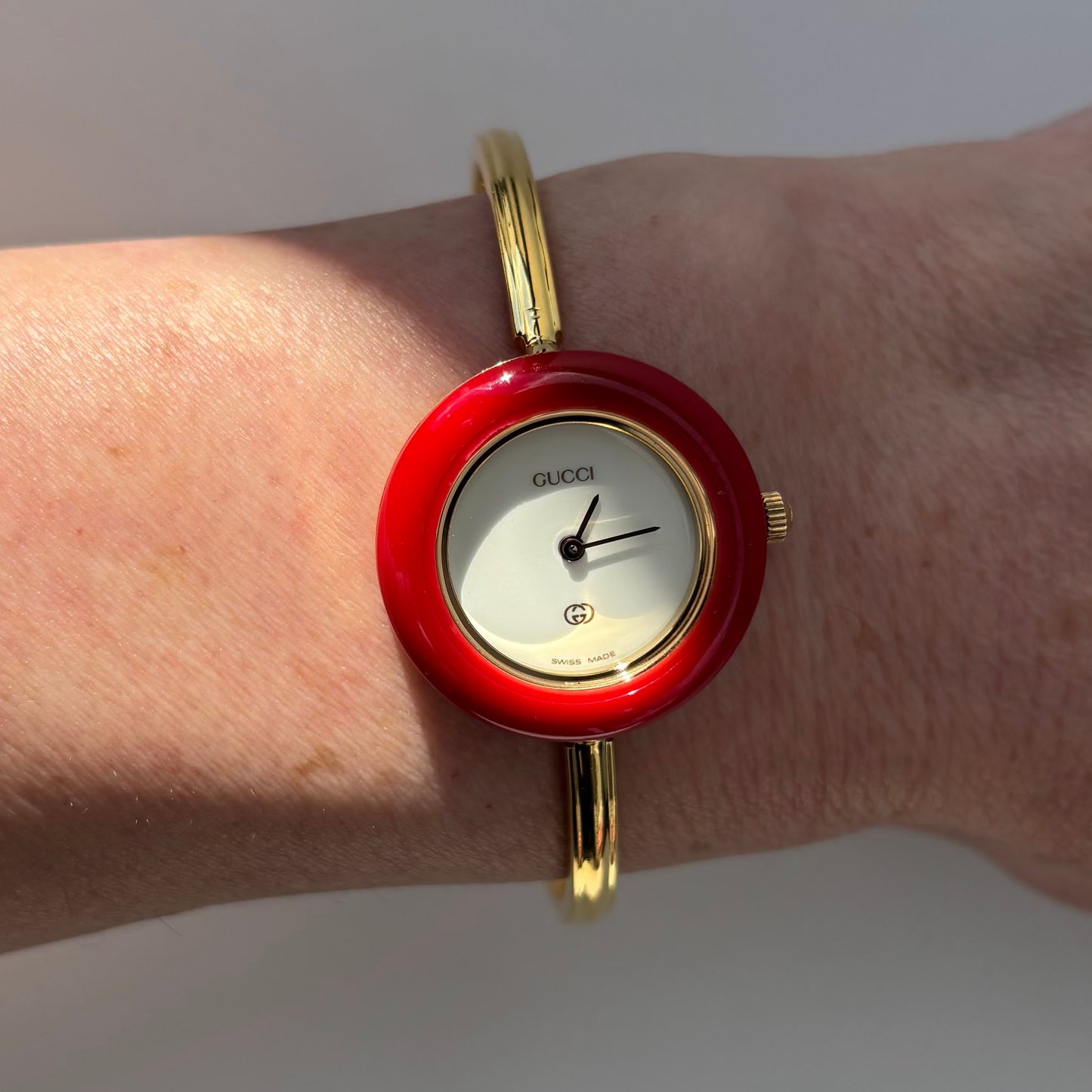 Gucci 1990s Interchangeable Bezel Gold Plated Bangle Watch with 12 bezels, case