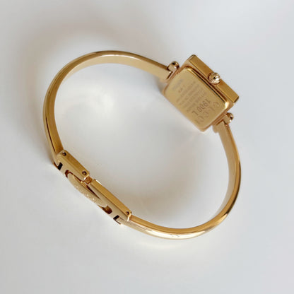 Gucci 1990s Seashell Square Dial Gold Plated Bangle Watch