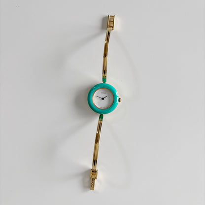 Gucci 1990s Interchangeable Bezel Gold Plated Bangle Watch with 12 bezels, case
