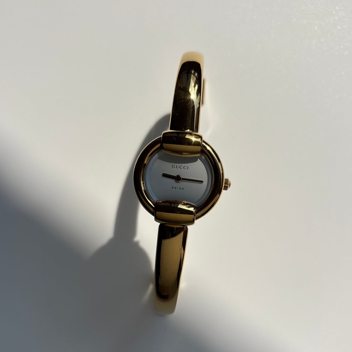 Gucci Round Dial Gold-Plated Bangle Watch