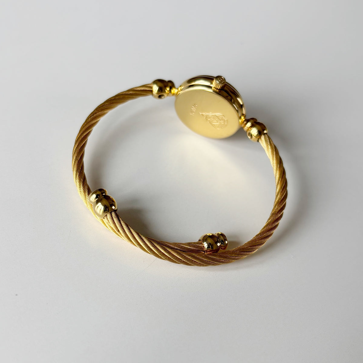 Gucci 1990s Black Round Dial Cable Gold Plated Bangle Watch