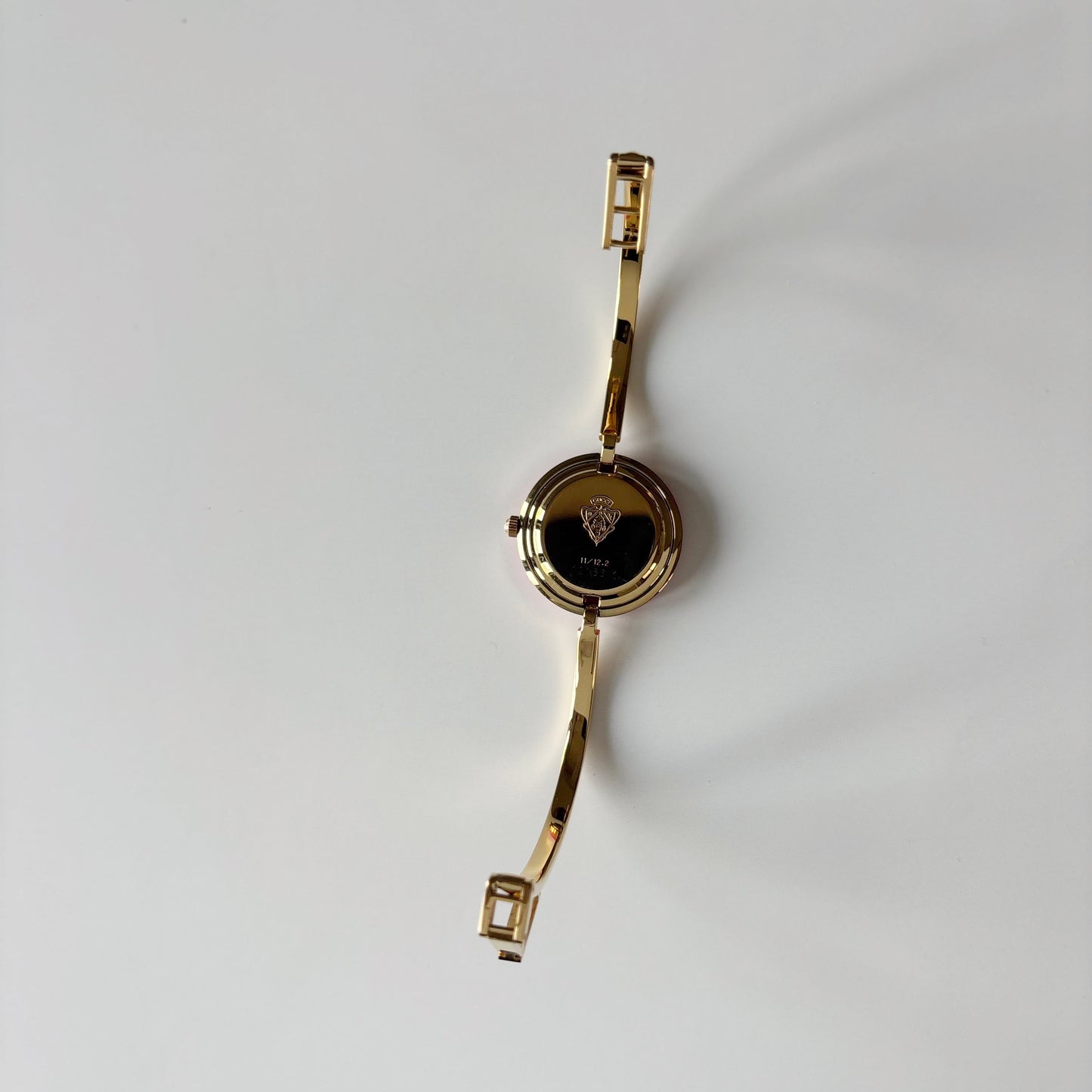 Gucci 1990s Interchangeable Bezel Gold Plated Bangle Watch with case, 12 bezels