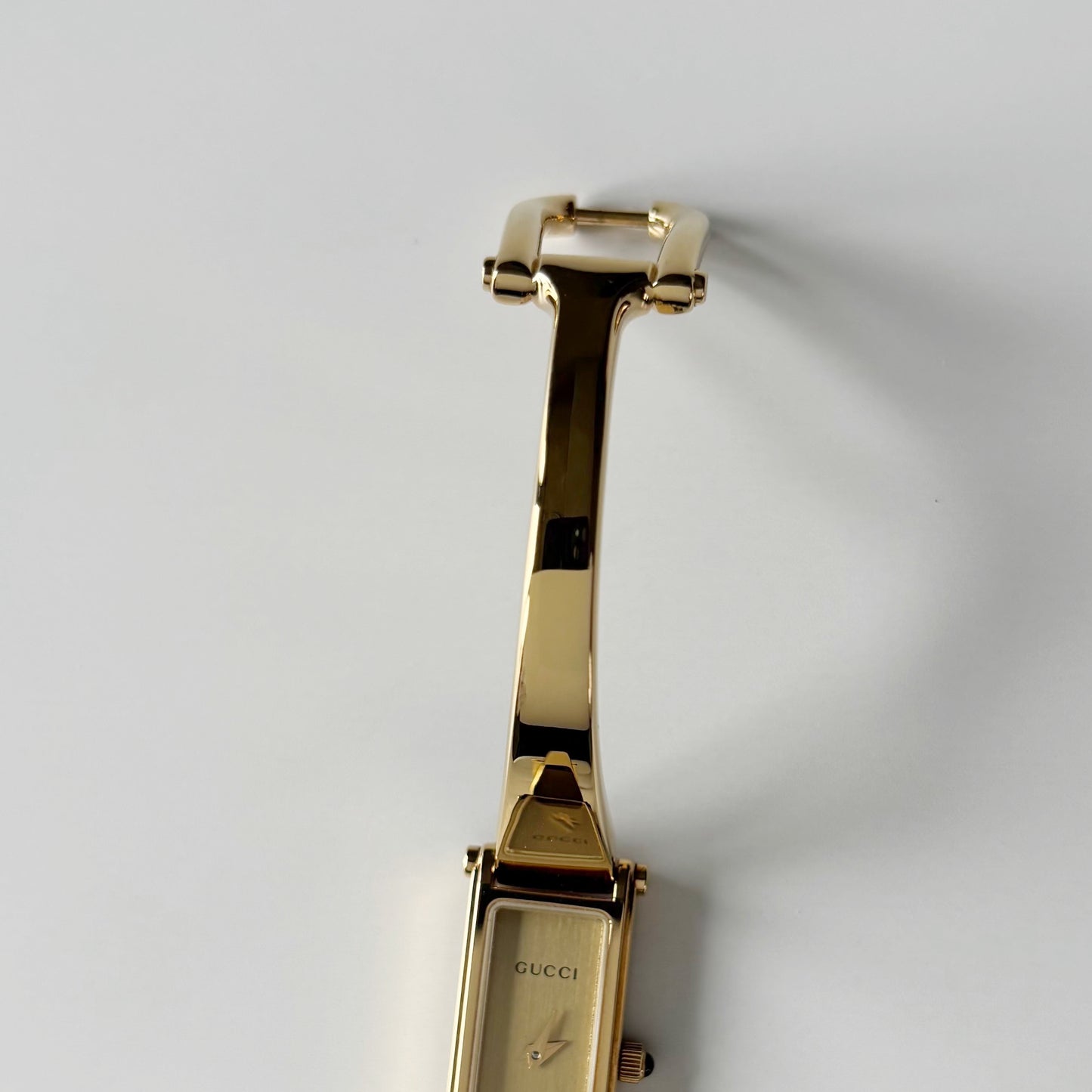 Gucci 1990s Gold Rectangular Dial Gold Plated Bangle Watch