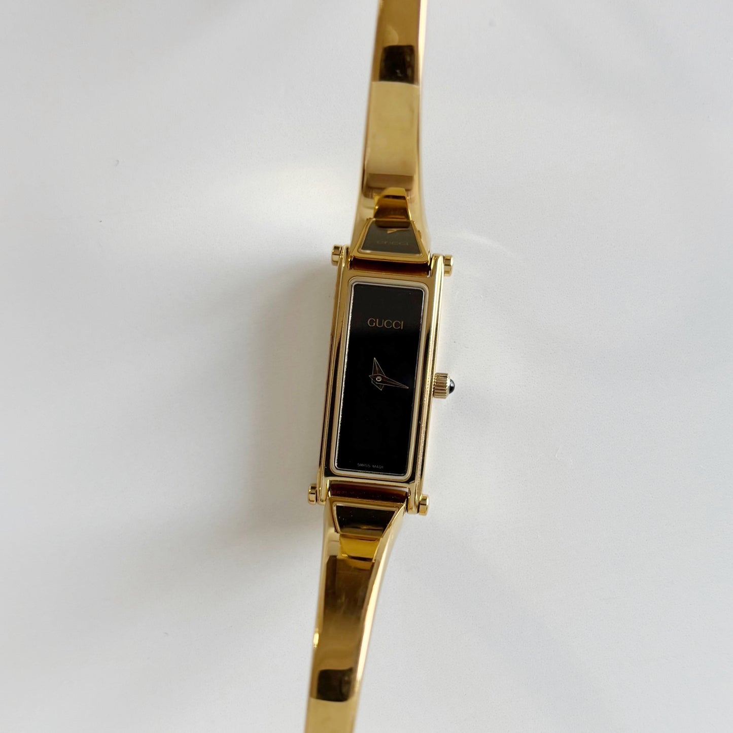 Gucci 1990s Black Dial Rectangular Gold Plated Bangle Watch