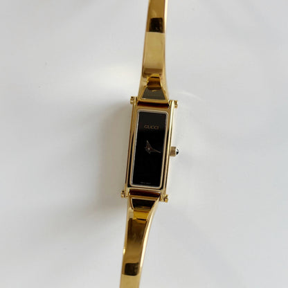Gucci 1990s Black Dial Rectangular Gold Plated Bangle Watch