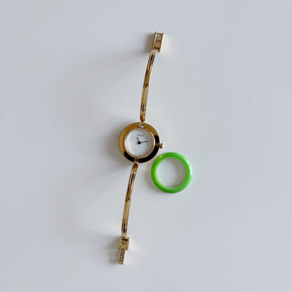 Gucci 1990s Interchangeable Bezel Gold Plated Bangle Watch with 12 bezels, case