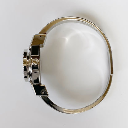 André Mouche Early 2000s Peek-A-Boo Silver Bangle Watch