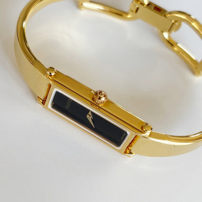 Gucci 1990s Black Rectangular Dial Gold Plated Bangle Watch