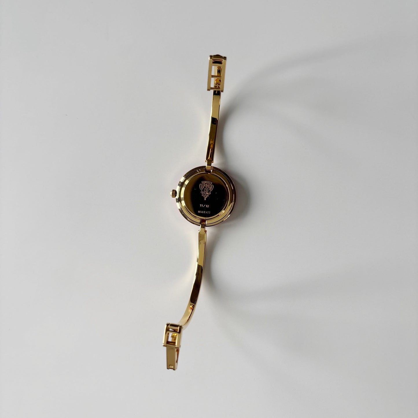 Gucci 1990s Interchangeable Bezel Gold Plated Bangle Watch with 12 bezels, case