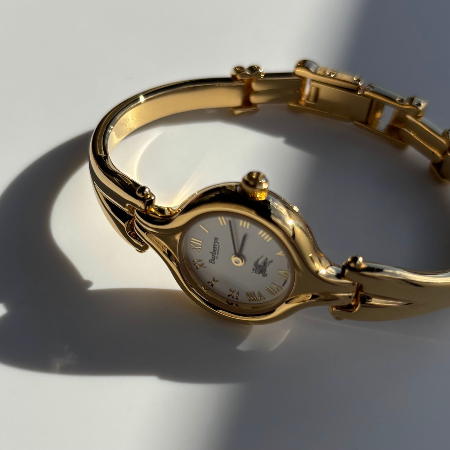 Burberry 1990s Round Dial Gold Plated Bangle Watch