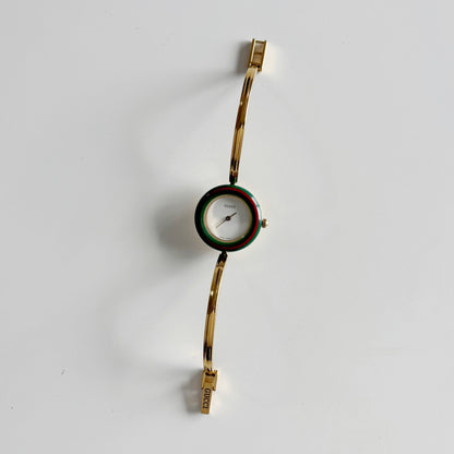 Gucci 1990s Interchangeable Bezel Gold Plated Bangle Watch with 12 bezels, case