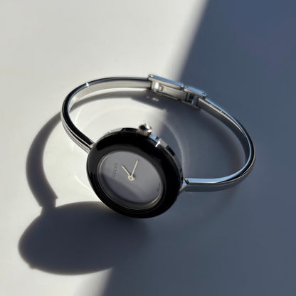 Gucci 1990s Interchangeable Bezel Stainless steel Bangle Watch with 12 bezels, case