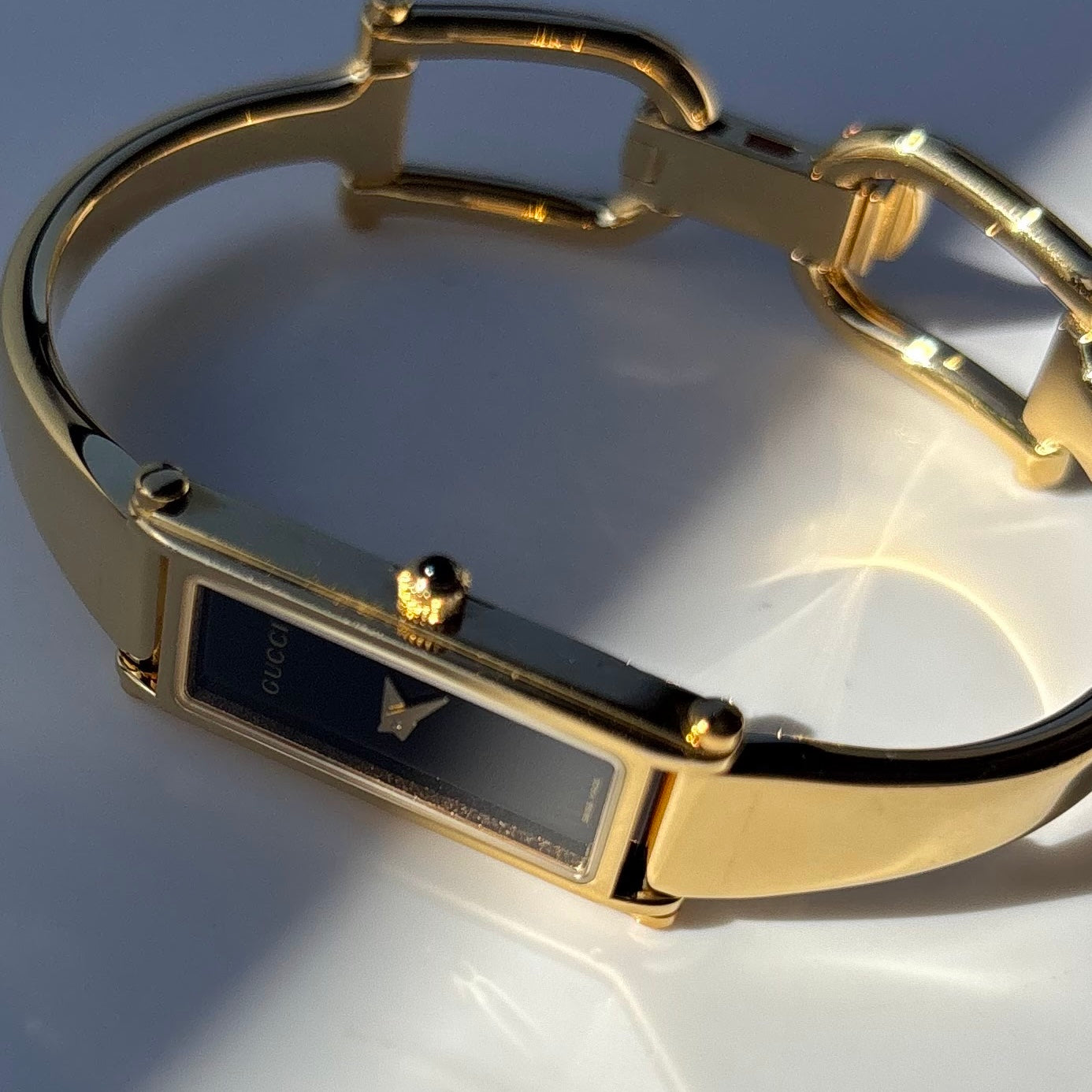 Gucci 1990s Black Dial Gold Plated Bangle Watch