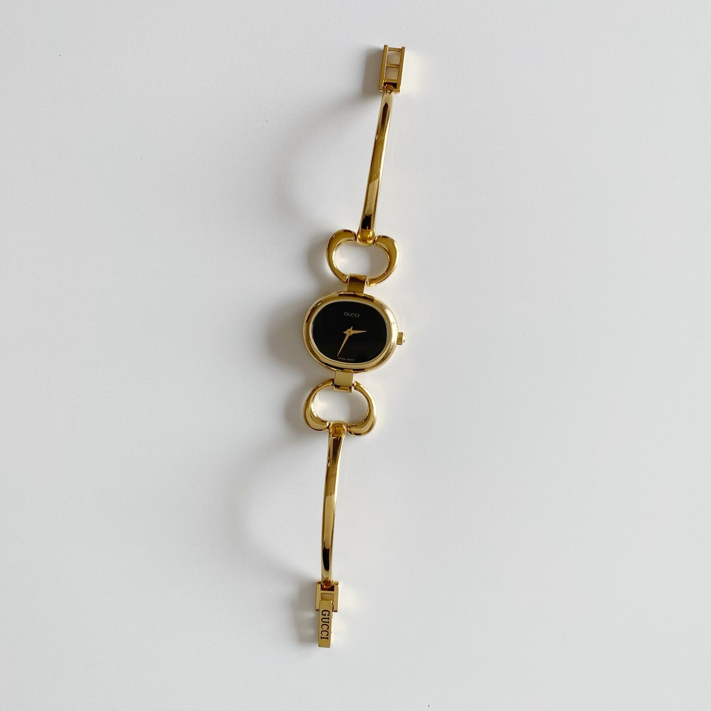 Gucci 1990s Black Dial Gold Plated Bangle Watch