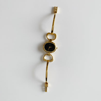 Gucci 1990s Black Dial Gold Plated Bangle Watch