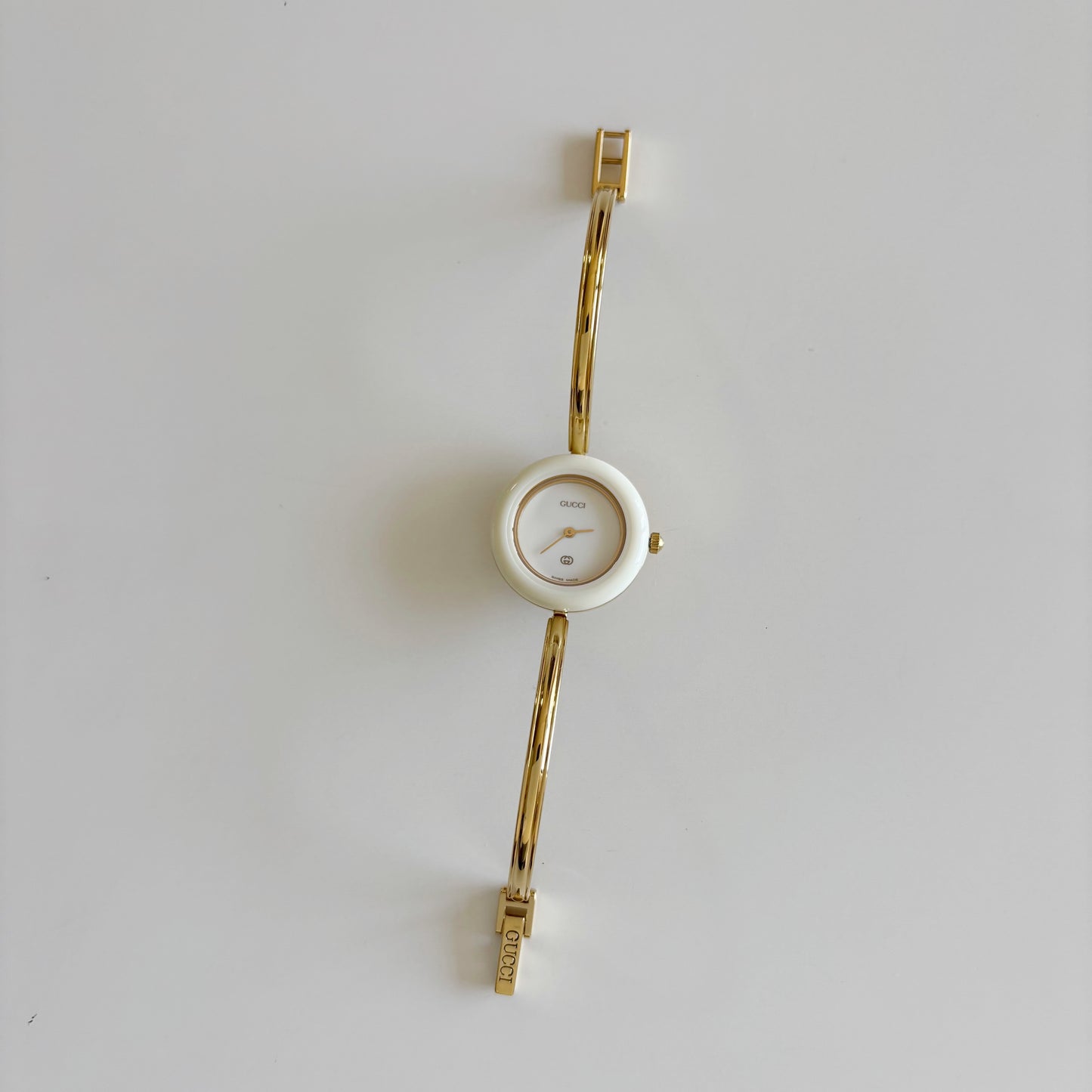 Gucci 1980s Interchangeable Bezel Gold Plated Bangle Watch with 12 bezels, case