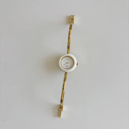 Gucci 1980s Interchangeable Bezel Gold Plated Bangle Watch with 12 bezels, case