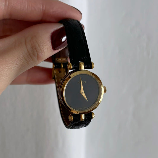 Gucci 1990s Gold Black Round Leather Watch