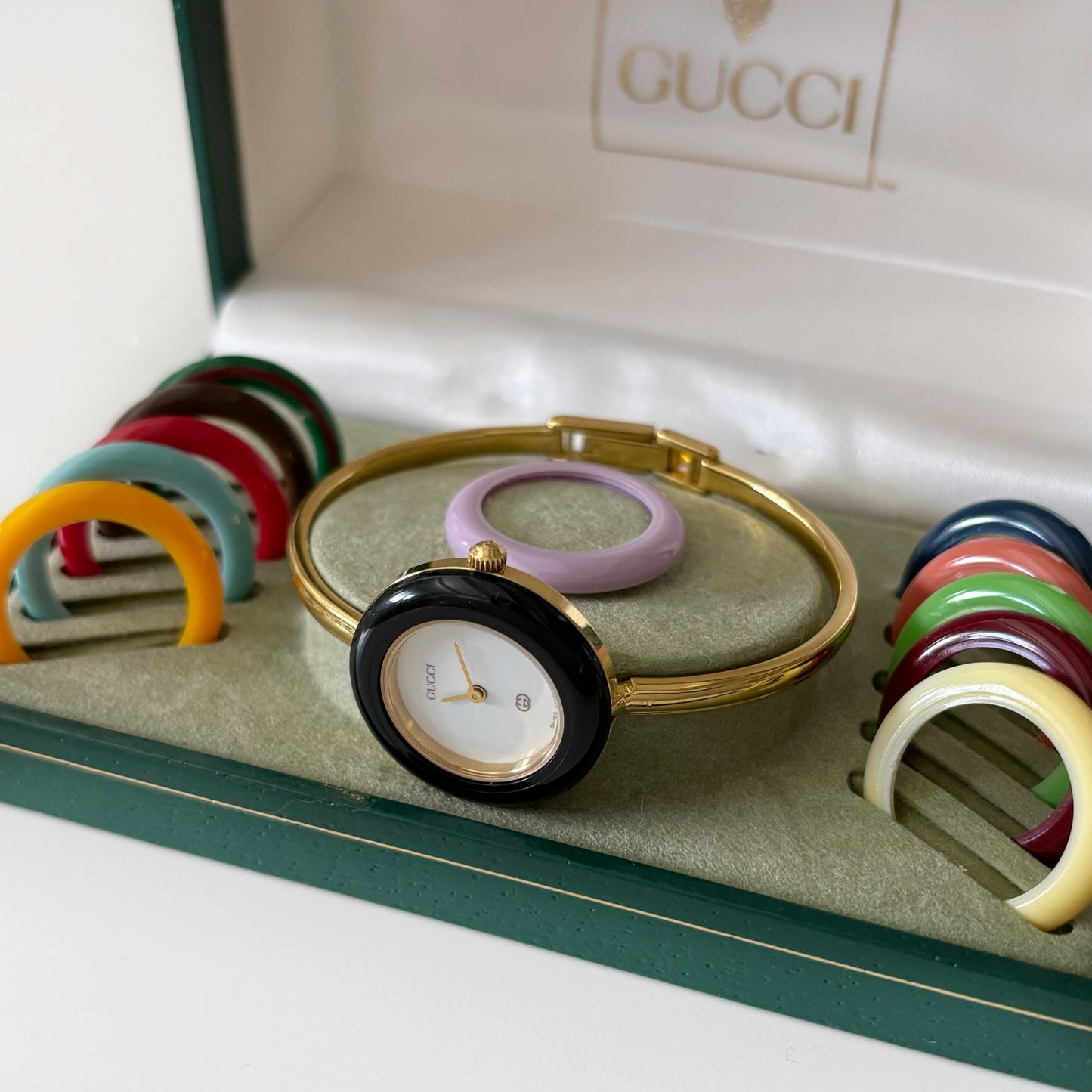 Gucci 1990s Interchangeable Bezel Gold Plated Bangle Watch with 12 bezels, case