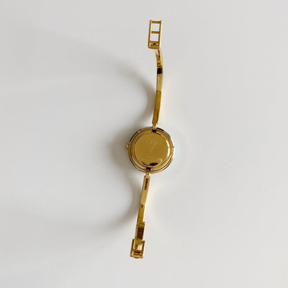 Gucci 1990s Interchangeable Bezel Gold Plated Bangle Watch with 12 bezels, case
