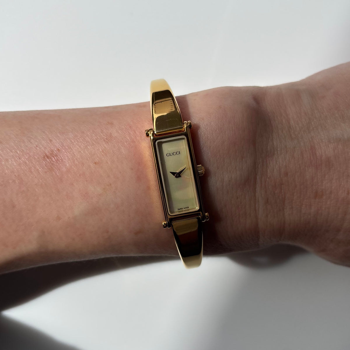 Gucci 1990s Seashell Rectangular Dial Gold Plated Bangle Watch