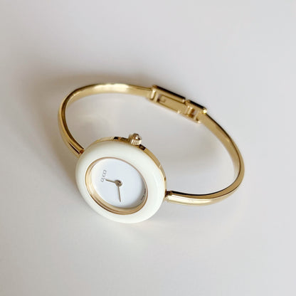 Gucci 1990s Interchangeable Bezel Gold Plated Bangle Watch with 12 bezels, case