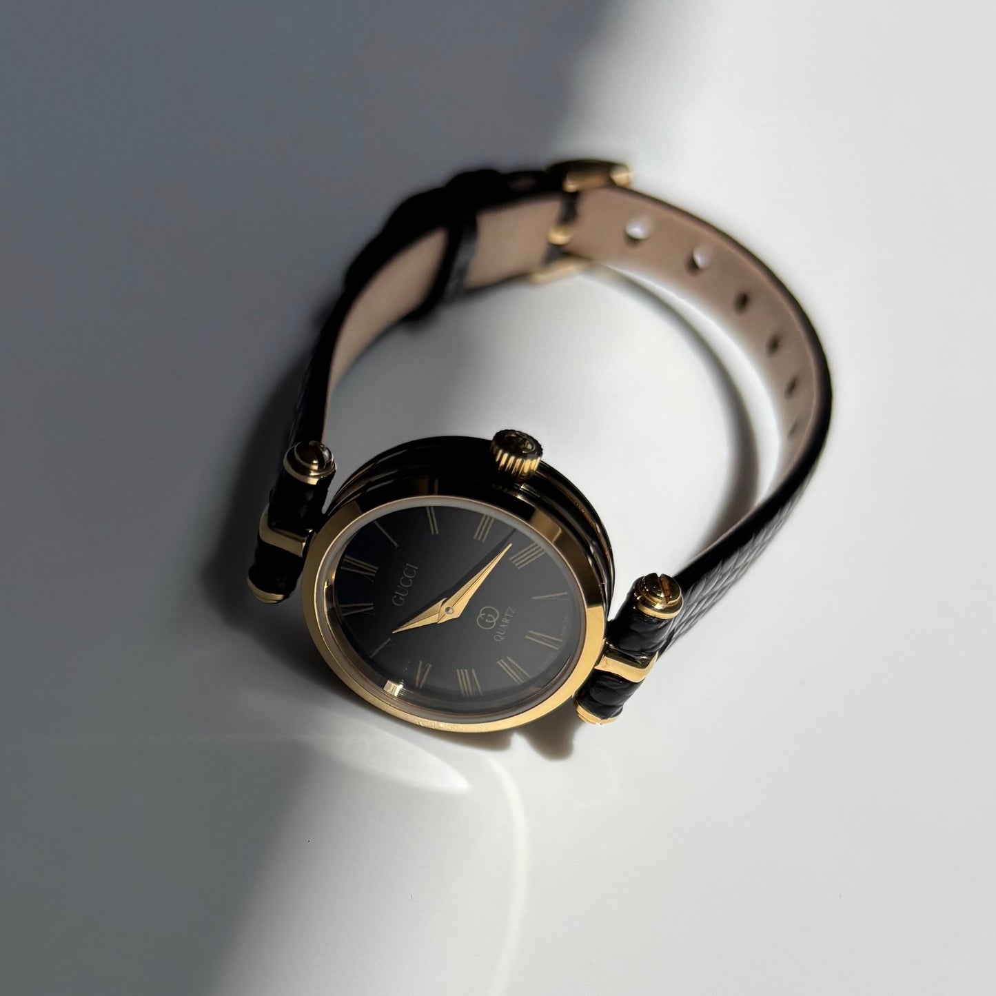Gucci 1980s Black Round Dial Gold Plated Watch