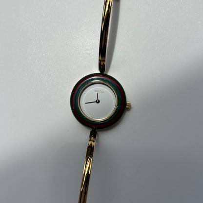 Gucci 1990s Interchangeable Bezel Gold Plated Bangle Watch with 12 bezels, case