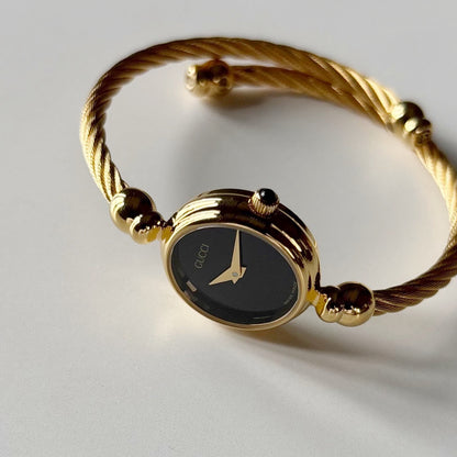 Gucci 1990s Black Dial Gold Plated Cable Bangle Watch