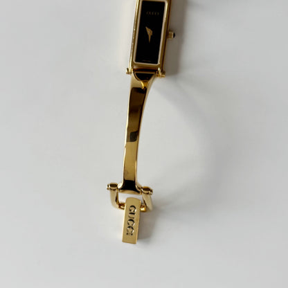 Gucci 1990s Black Rectangular Dial Gold Plated Bangle Watch