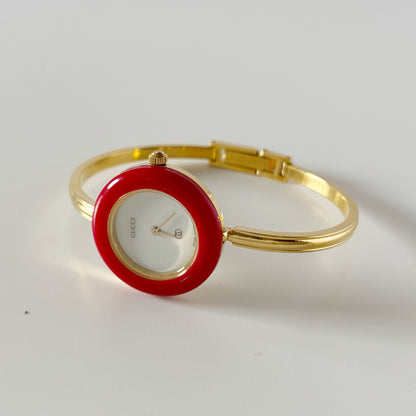 Gucci 1990s Interchangeable Bezel Gold Plated Bangle Watch with 12 bezels, case